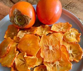Solar dried persimmon processed for better preservation, enhanced flavor, and longer shelf stability.