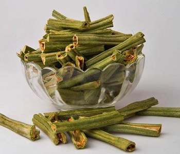 Nutrient-rich moringa leaves dried naturally using solar technology for food products.